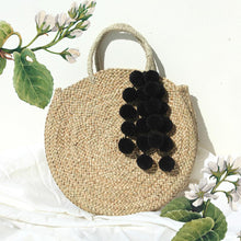 Load image into Gallery viewer, Luna Bag - Round Straw Tote Bag with Black Tiered Pom-poms
